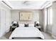 Bright bedroom with king-size bed and neutral color palette at 105 Fillmore St # 204, Denver, CO 80206