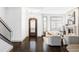 Bright entryway with hardwood floors, modern staircase, and fireplace at 105 Fillmore St # 204, Denver, CO 80206