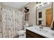 Clean bathroom with a shower-tub combo, toilet, and a sink with a vanity at 31258 Niakwa Rd, Evergreen, CO 80439