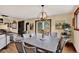 Charming dining area with backyard views, chandelier, and wood accents at 31258 Niakwa Rd, Evergreen, CO 80439