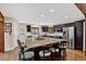 Bright kitchen features granite countertops, stainless steel appliances, and a large island with seating at 31258 Niakwa Rd, Evergreen, CO 80439