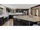 Well-equipped kitchen featuring granite countertops, stainless steel appliances, and a spacious island for seating at 31258 Niakwa Rd, Evergreen, CO 80439