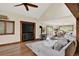 The cozy living area has hardwood floors, lots of light, and a charming wood-burning stove at 31258 Niakwa Rd, Evergreen, CO 80439