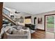 Cozy living room showcases hardwood floors, wood trim, and a rustic wood-burning stove at 31258 Niakwa Rd, Evergreen, CO 80439