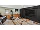 Stylish living room with a modern pellet stove, a large TV, and comfortable seating at 31258 Niakwa Rd, Evergreen, CO 80439