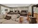 Cozy living room with comfortable seating, a pellet stove, and a dartboard on the wall at 31258 Niakwa Rd, Evergreen, CO 80439