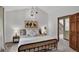 Bright bedroom featuring vaulted ceiling, pendant lighting and an adjoining door to another room at 31258 Niakwa Rd, Evergreen, CO 80439