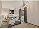 Bedroom featuring neutral paint, carpet, pendant lighting, and a large window at 31258 Niakwa Rd, Evergreen, CO 80439