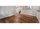 Spacious basement featuring hardwood floors and access to the stairs at 13849 W 66Th Dr, Arvada, CO 80004