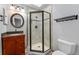 Bathroom featuring a granite vanity top and updated glass shower at 13849 W 66Th Dr, Arvada, CO 80004