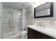 Bathroom featuring a modern shower, vanity, and stylish fixtures at 13849 W 66Th Dr, Arvada, CO 80004