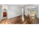 A spacious bedroom boasts hardwood floors and a view of the deck at 13849 W 66Th Dr, Arvada, CO 80004