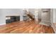 Spacious entryway with hardwood floors and stairs leading to the upper level at 13849 W 66Th Dr, Arvada, CO 80004