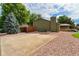 Exterior view of home featuring a fenced yard and mature landscaping at 13849 W 66Th Dr, Arvada, CO 80004