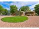 Well-maintained front yard featuring mature trees and landscaping at 13849 W 66Th Dr, Arvada, CO 80004