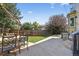 View of the backyard that offers a patio with a dining set, grill, and grass at 10343 Stoneflower Dr, Parker, CO 80134