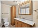 Clean, basic bathroom with a single vanity and tiled floors at 10343 Stoneflower Dr, Parker, CO 80134