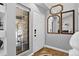 Bright foyer featuring decorative tile flooring, a window to the porch, and multiple decorative mirrors at 10343 Stoneflower Dr, Parker, CO 80134