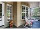Comfortable front porch with view and wicker seating, offering a relaxing outdoor space with neighborhood view at 10343 Stoneflower Dr, Parker, CO 80134