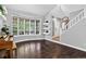 Bright living room with hardwood floors, large bay window and elegant decor, creating a warm and inviting space at 10343 Stoneflower Dr, Parker, CO 80134