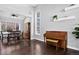 Bright living room with hardwood floors, and dining area, creating a spacious and inviting space at 10343 Stoneflower Dr, Parker, CO 80134