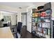 This office has dark hardwood floors, big bookshelf, and lots of natural light at 10343 Stoneflower Dr, Parker, CO 80134