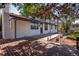 Backyard featuring a pergola, wooden deck, concrete patio and access to the house at 10851 E Iliff Pl, Aurora, CO 80014
