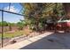 Backyard featuring a pergola, wooden deck, concrete patio, lawn and a garden at 10851 E Iliff Pl, Aurora, CO 80014
