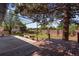 Backyard featuring a pergola, wooden deck, concrete patio and lawn at 10851 E Iliff Pl, Aurora, CO 80014