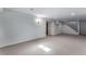 Spacious basement featuring neutral carpet, and white painted walls at 10851 E Iliff Pl, Aurora, CO 80014