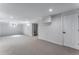 Large, bright basement featuring neutral carpet and white painted walls at 10851 E Iliff Pl, Aurora, CO 80014