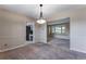 Open dining area with carpet, natural light and adjacent rooms at 10851 E Iliff Pl, Aurora, CO 80014