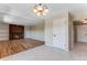 Inviting living room with a brick fireplace, built-in shelves, and hardwood flooring, perfect for gatherings at 10851 E Iliff Pl, Aurora, CO 80014