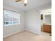 Bedroom with tan carpet features a window and attached bathroom at 23465 E Platte Dr # B, Aurora, CO 80016