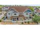 Attractive townhome featuring stone accents, light blue siding, and a neatly landscaped front yard at 23465 E Platte Dr # B, Aurora, CO 80016