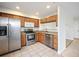 Functional kitchen with stainless steel appliances and tile flooring at 23465 E Platte Dr # B, Aurora, CO 80016