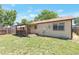 Spacious backyard with wooden fence, lawn, and wooden deck perfect for outdoor enjoyment at 3577 S Ouray Cir, Aurora, CO 80013