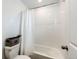 Clean and functional bathroom featuring a white tiled shower and classic fixtures at 947 W Beverly St, Elizabeth, CO 80107