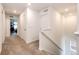 Upstairs hallway with a carpeted floor and white walls leads to multiple rooms with plenty of lighting at 947 W Beverly St, Elizabeth, CO 80107