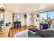 Sunlit living room featuring hardwood floors and lots of natural light at 4332 Bruce Randolph Ave, Denver, CO 80207