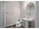 Bathroom features a stand-up shower, a pedestal sink, and a large mirror in a neutral color palette at 479 Interlocken Blvd # 105, Broomfield, CO 80021