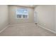 Spacious bedroom with neutral carpet, light walls, and a window with blinds at 479 Interlocken Blvd # 105, Broomfield, CO 80021
