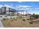 Outdoor community space with BBQ grills, picnic tables, and a playground at 479 Interlocken Blvd # 105, Broomfield, CO 80021