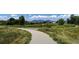 Take a stroll along the paved path surrounded by lush greenery and mountain views at 479 Interlocken Blvd # 105, Broomfield, CO 80021