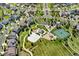 Aerial view of a residential area with a park, tennis court, and playground at 23913 E Swallow Cir, Aurora, CO 80016