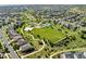 Aerial view of a residential area with a park and walking trails at 23913 E Swallow Cir, Aurora, CO 80016