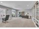 Basement featuring built-in shelving, natural light and a desk area at 23913 E Swallow Cir, Aurora, CO 80016