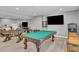 Spacious finished basement features foosball and pool table, creating an entertainment space at 23913 E Swallow Cir, Aurora, CO 80016
