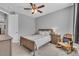 Relaxing bedroom with ceiling fan, plush carpet, large window, and calming grey walls at 23913 E Swallow Cir, Aurora, CO 80016