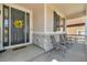 Comfortable porch with seating area, stone accents, and a welcoming front door at 23913 E Swallow Cir, Aurora, CO 80016